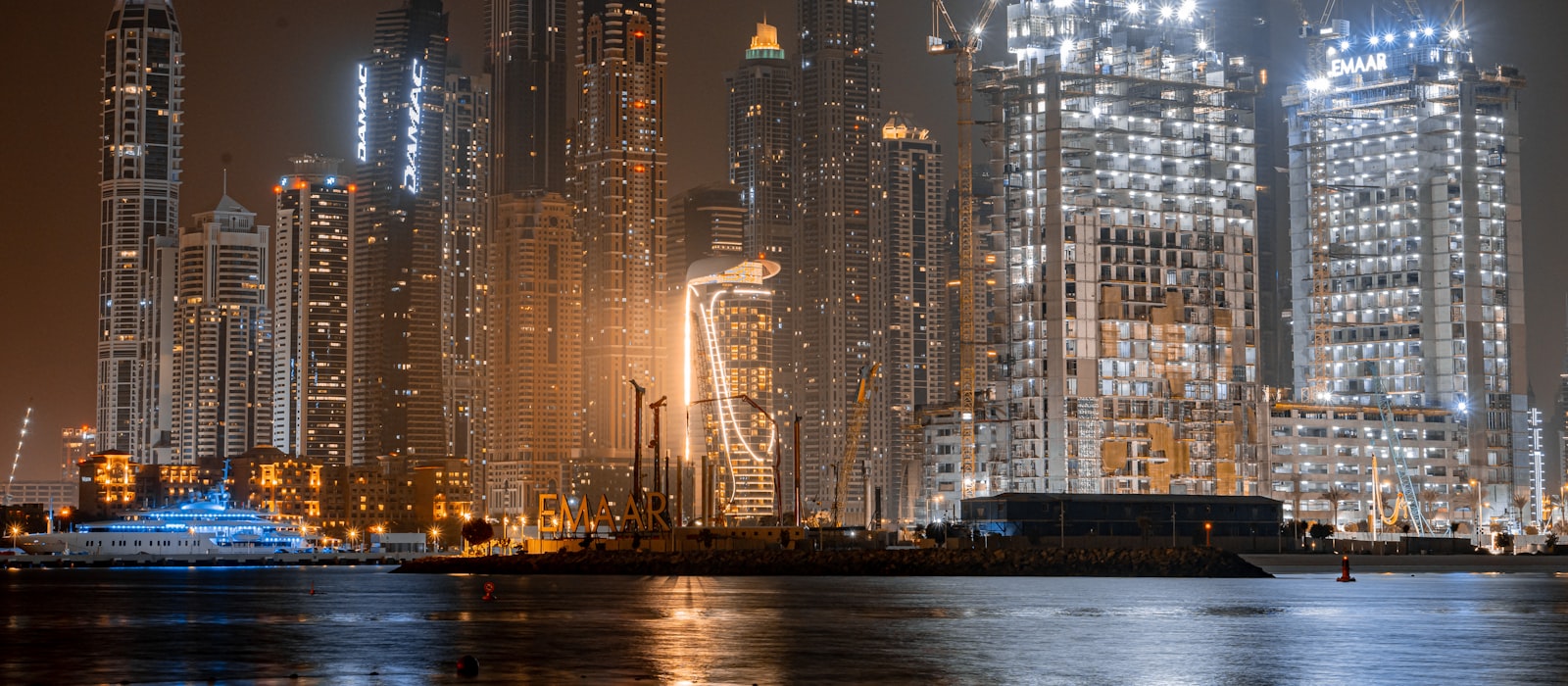 Dubai skyline at night with light reflections — the competitive market backdrop for Dubai SEO and AEO pricing